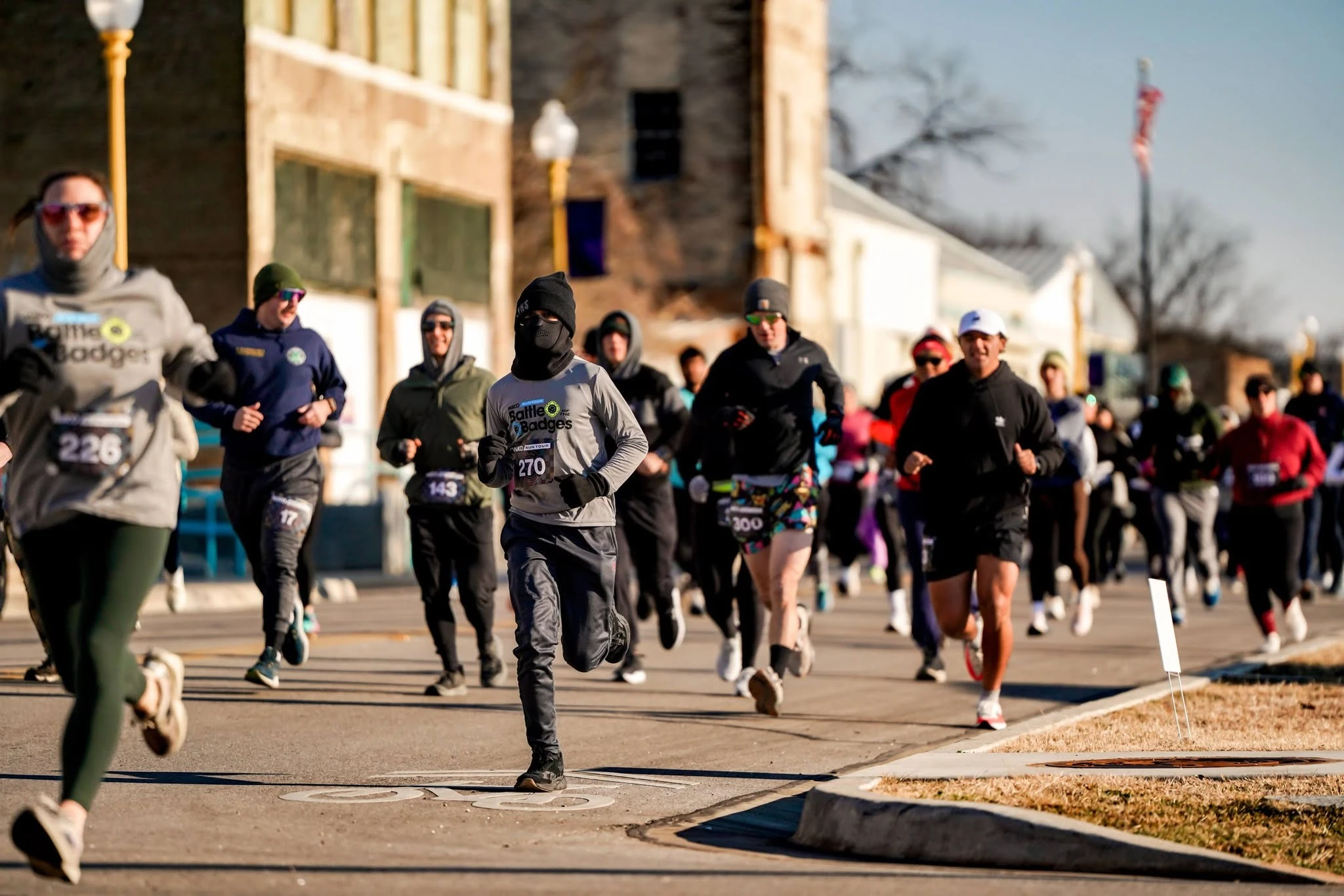 Runners wearing Waco Run Tour race bibs